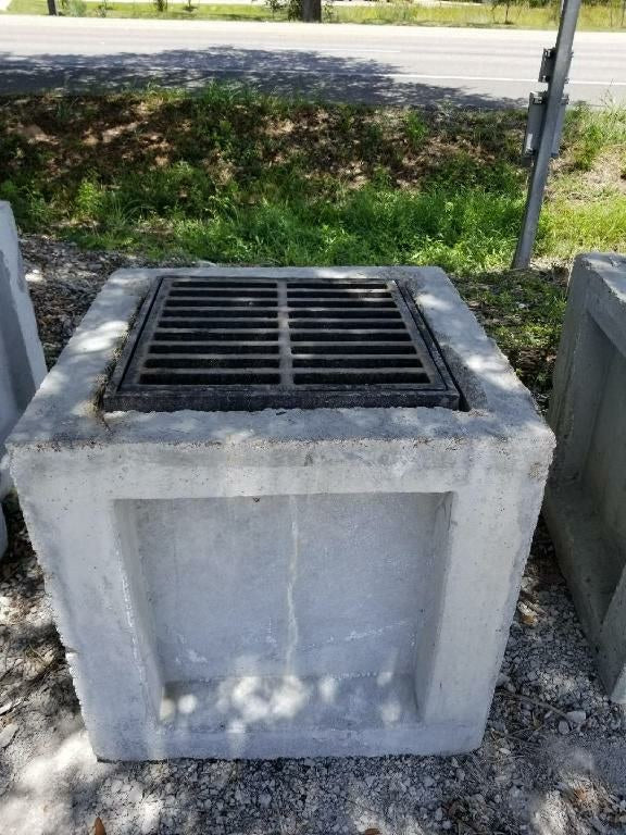 Texas Precast concrete catch basin fitted with a cast iron frame and grate