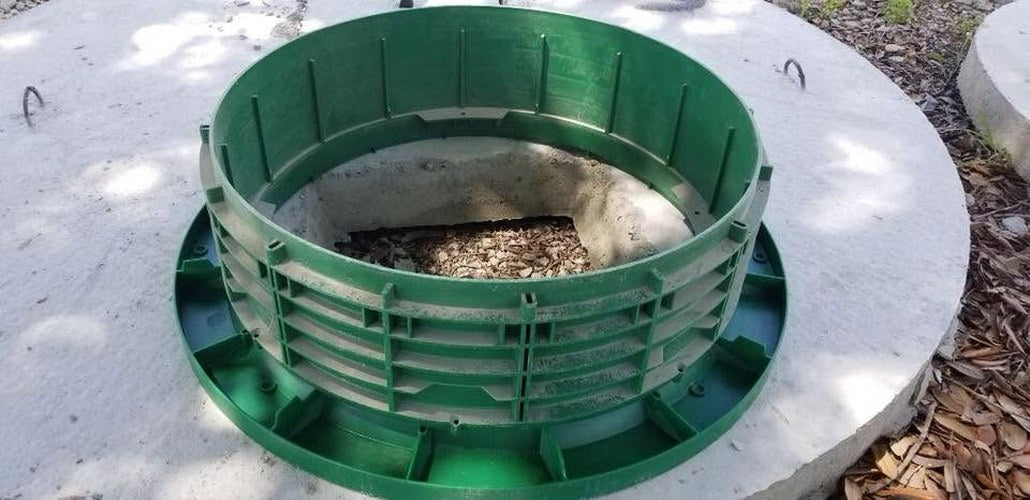 Top view of a Texas Precast 20 inch septic tank riser lid