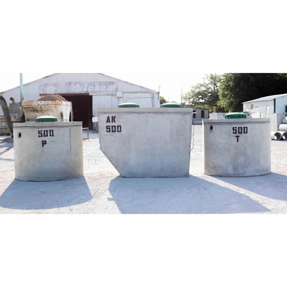 Texas Precast 500 gallon concrete pump and trash tanks in the manufacturing yard