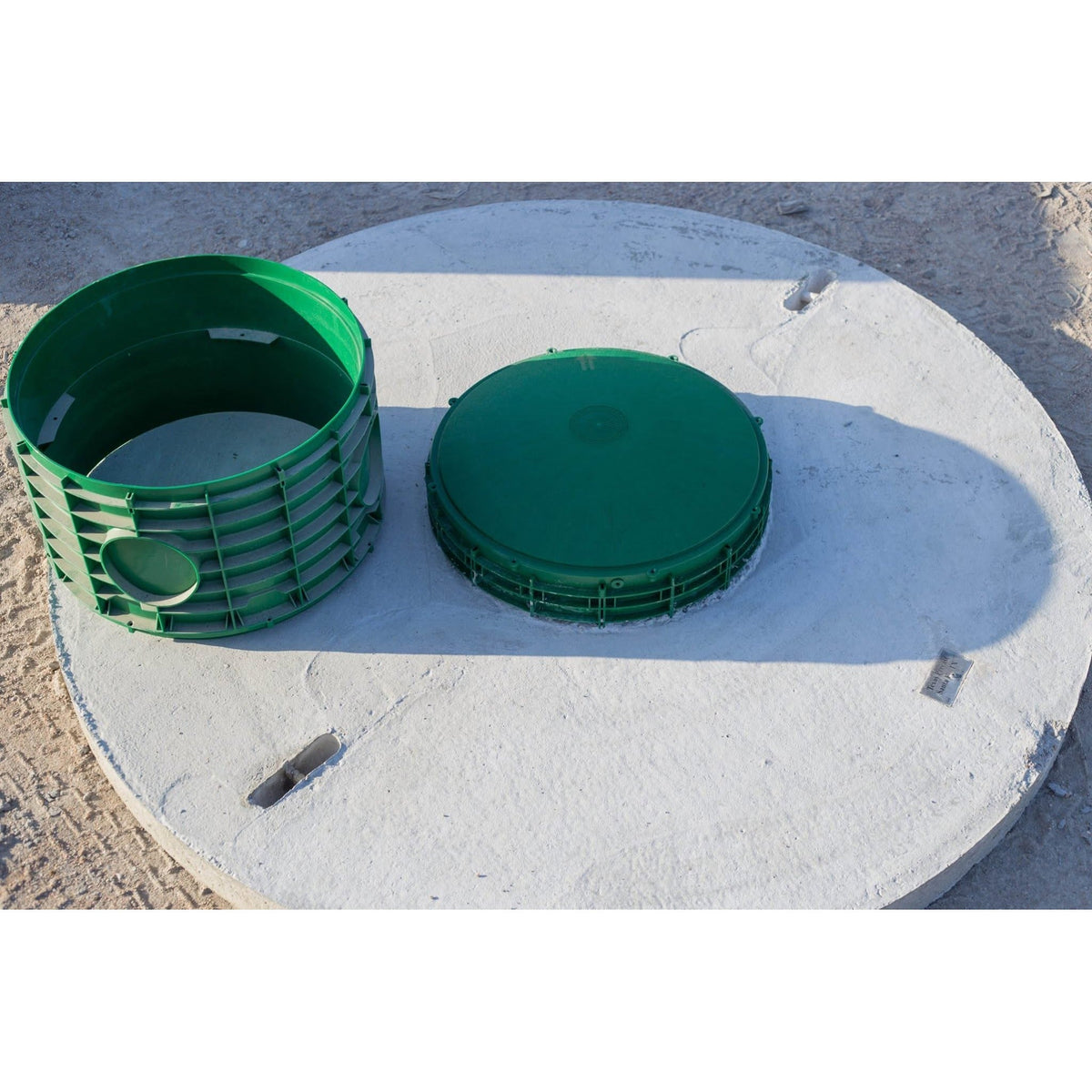 Riser ring and matching lid on a Texas Precast concrete tank lid