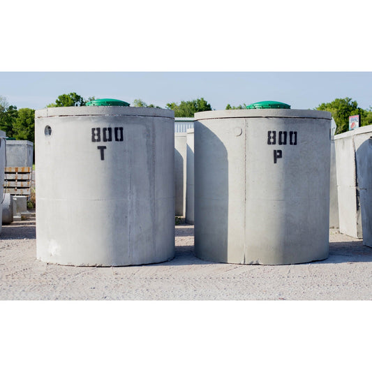 Texas Precast 800 gallon round concrete trash tank and pump tank side by side