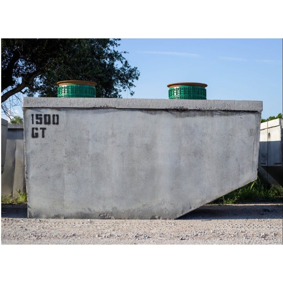 Texas Precast 1500 gallon concrete grease interceptor stencilled 1500 GT with two risers