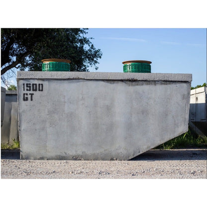 Texas Precast 1500 gallon concrete grease interceptor stencilled 1500 GT with two risers