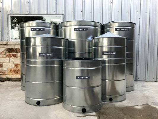 Texas Metal Tanks galvanized steel rainwater tanks lined up by size, 80 to 500 gallons