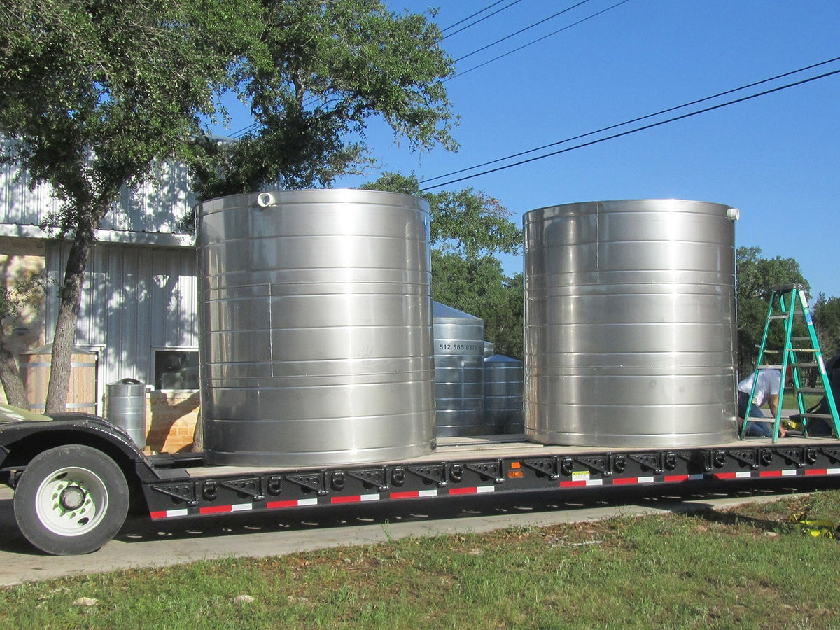 Texas Metal Tanks 2500 gallon stainless steel rainwater tank on a flatbed trailer